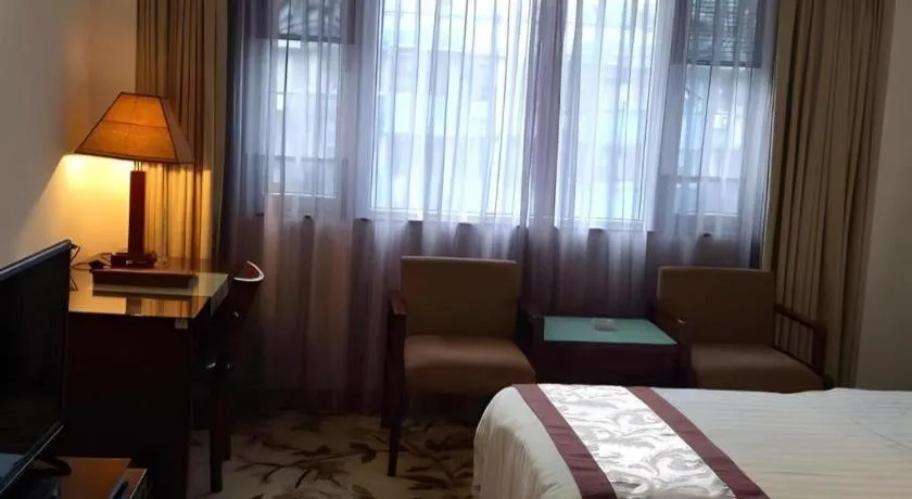 Bed in Hong Ye Hotel