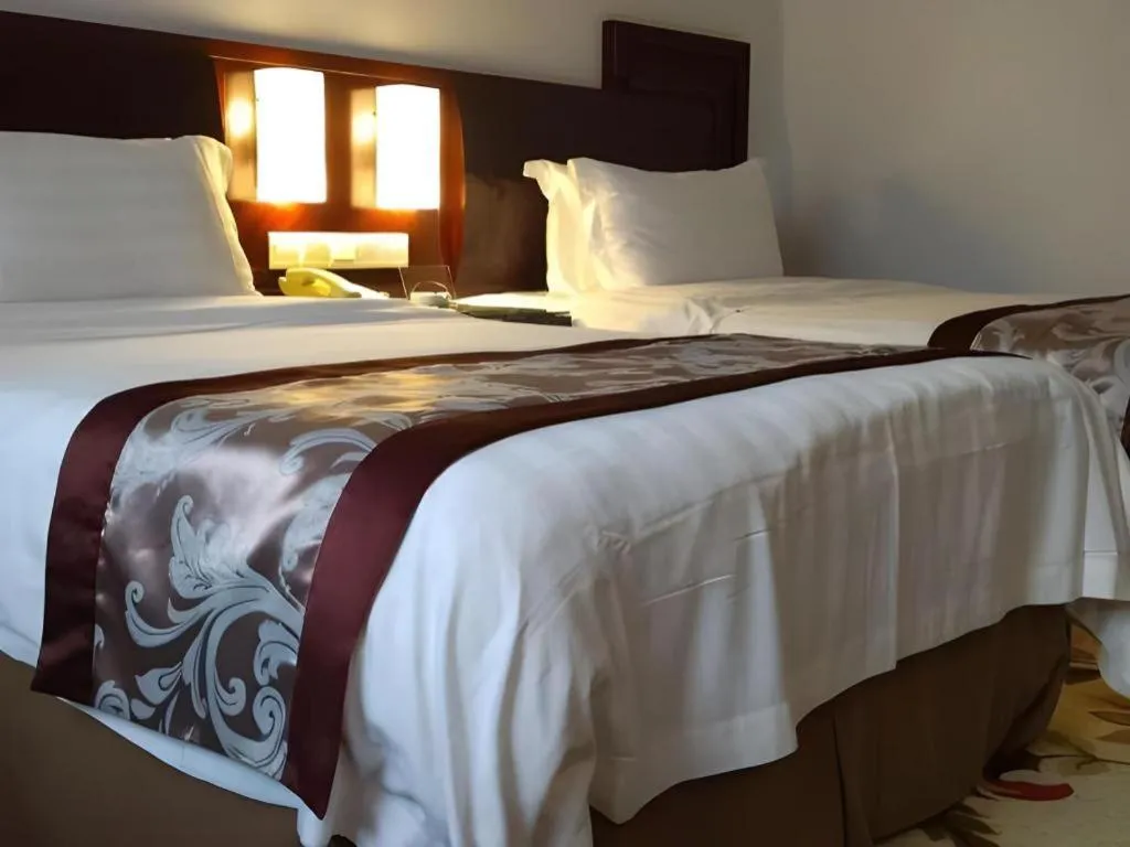Bed in Hong Ye Hotel