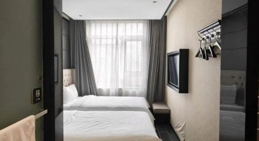 Bed in Xana Hotelle Beijing Fengtai Railway Station Tiantan Hospital