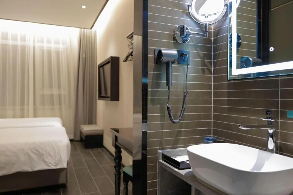 Bed in Xana Hotelle Beijing Fengtai Railway Station Tiantan Hospital