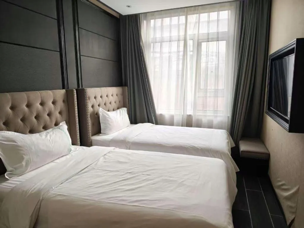 Bed in Xana Hotelle Beijing Fengtai Railway Station Tiantan Hospital