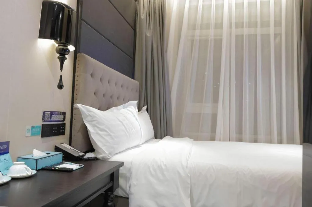 Bed in Xana Hotelle Beijing Fengtai Railway Station Tiantan Hospital