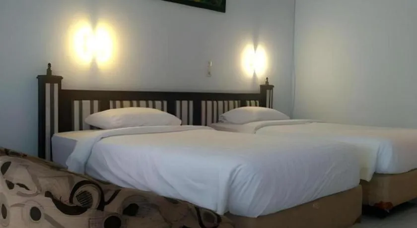 Bed in Toba Beach Hotel