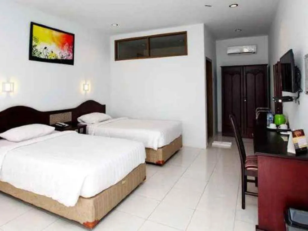 Bed in Toba Beach Hotel