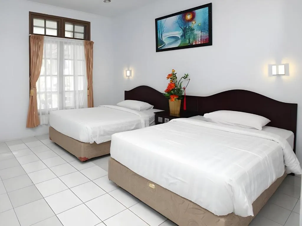 Bed in Toba Beach Hotel