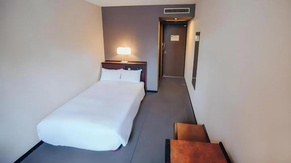 Bed in Hotel Areaone Miyazaki