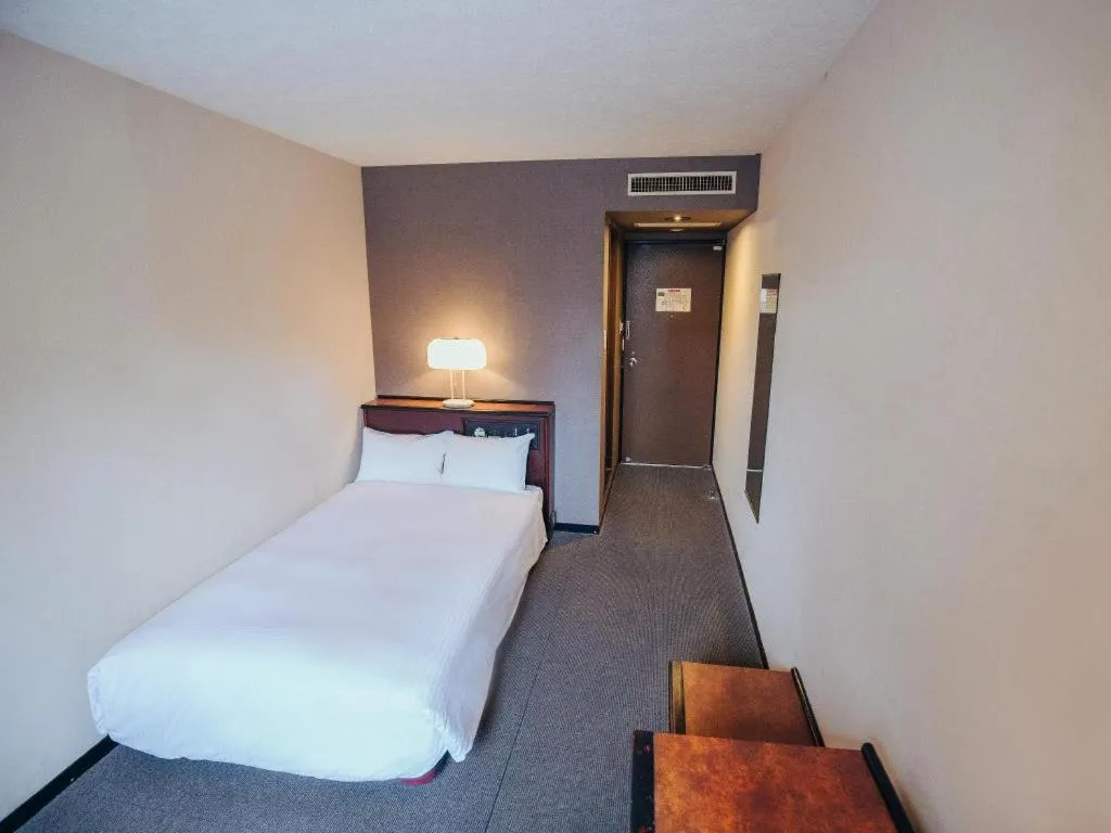 Bed in Hotel Areaone Miyazaki