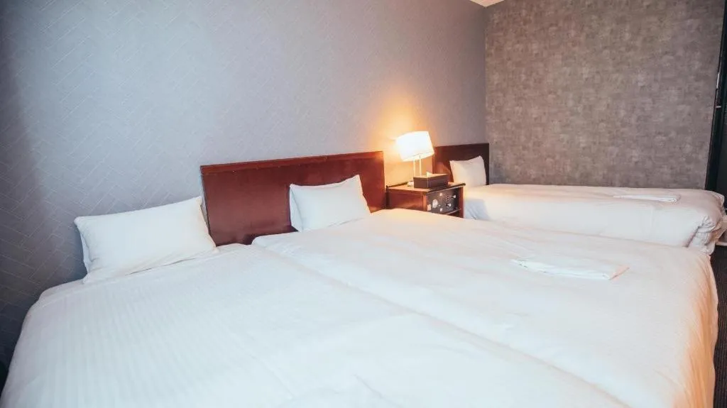 Bed in Hotel Areaone Miyazaki