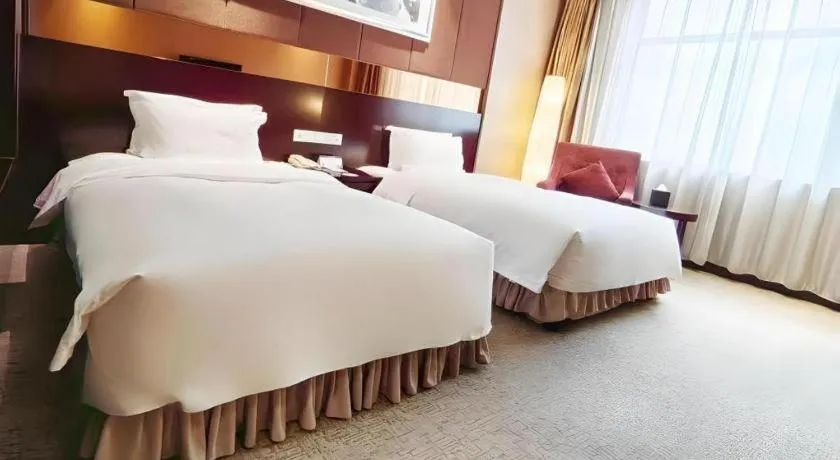Bed in Xian Grand Soluxe International Hotel
