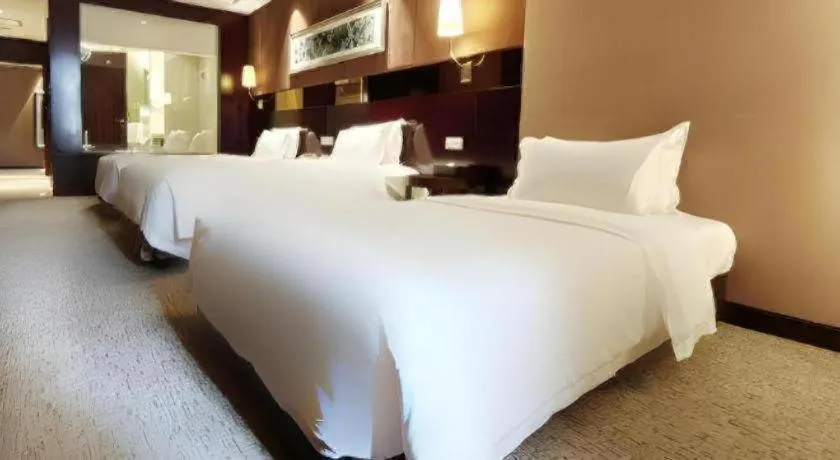 Bed in Xian Grand Soluxe International Hotel