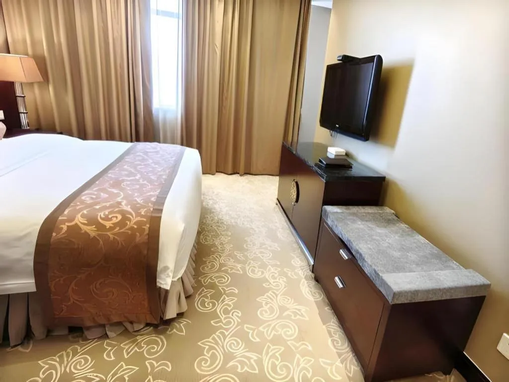 Bed in Xian Grand Soluxe International Hotel