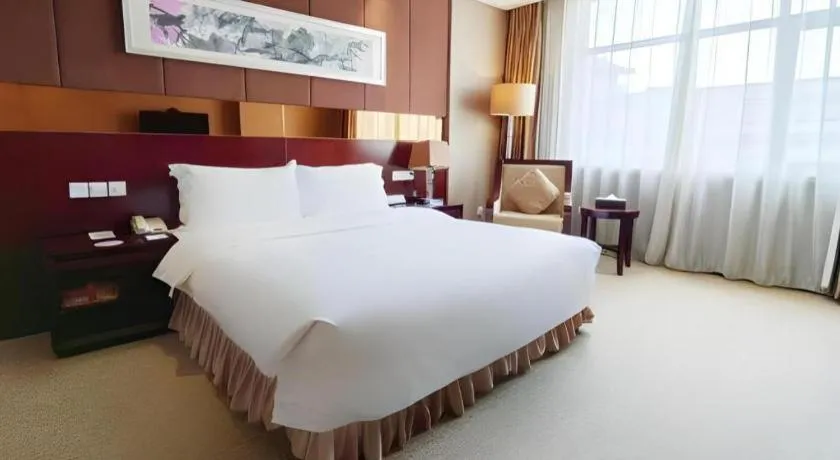Bed in Xian Grand Soluxe International Hotel