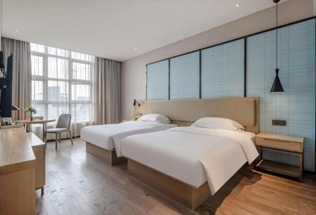 Bed in Echarm Hotel Baise Sports Center Dream Island Plaza