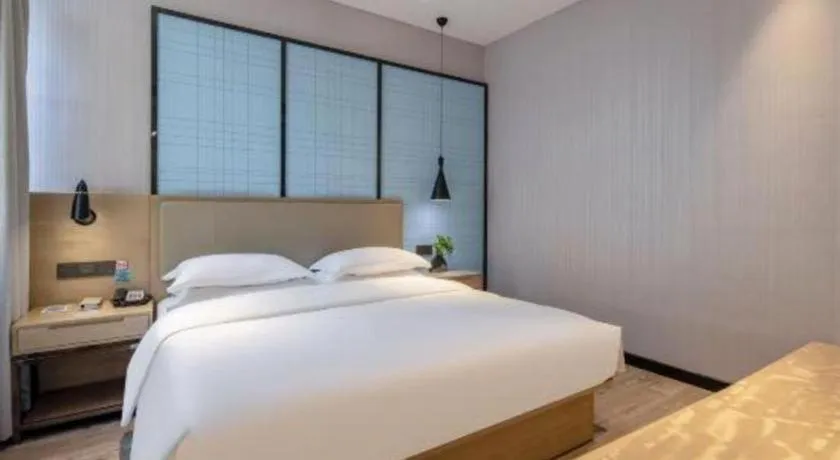 Bed in Echarm Hotel Baise Sports Center Dream Island Plaza