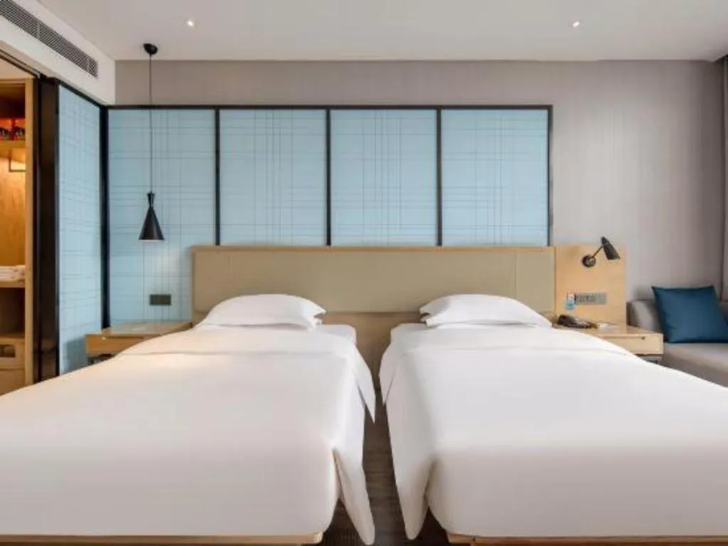 Bed in Echarm Hotel Baise Sports Center Dream Island Plaza