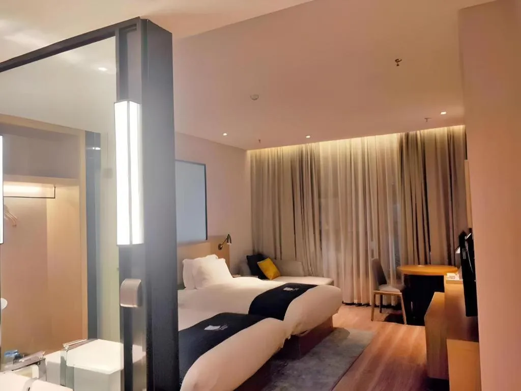 Bed in Echarm Hotel Baise Sports Center Dream Island Plaza