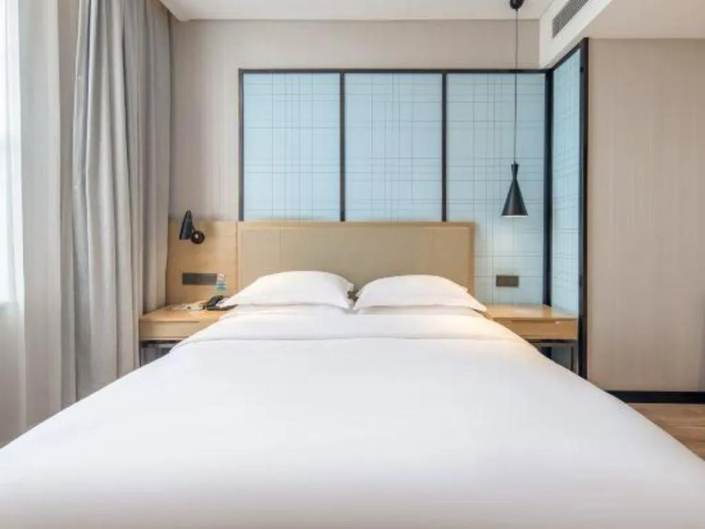 Bed in Echarm Hotel Baise Sports Center Dream Island Plaza