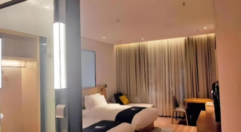 Bed in Echarm Hotel Baise Sports Center Dream Island Plaza