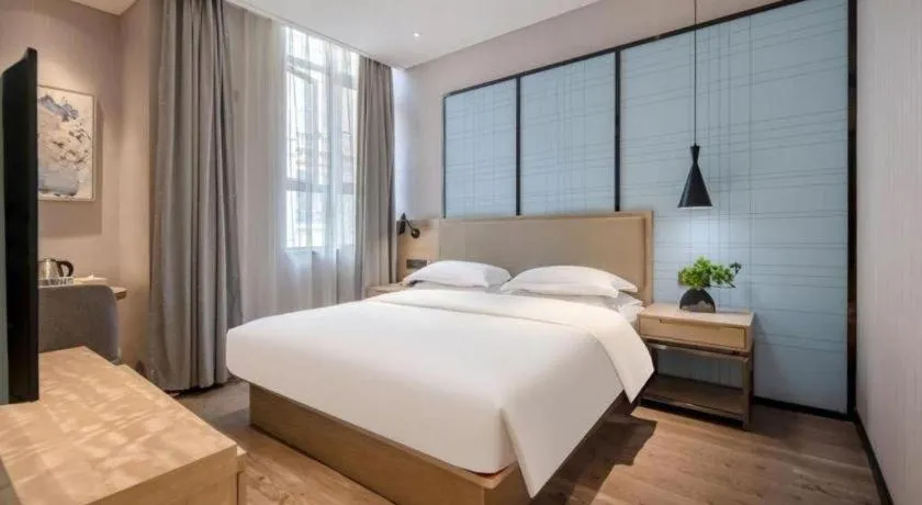 Bed in Echarm Hotel Baise Sports Center Dream Island Plaza