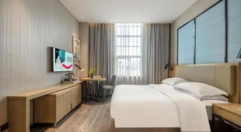 Bed in Echarm Hotel Baise Sports Center Dream Island Plaza