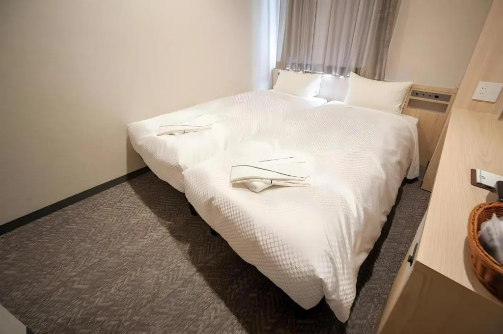 Bed in Hotel IL FIORE Kasai ANNEX