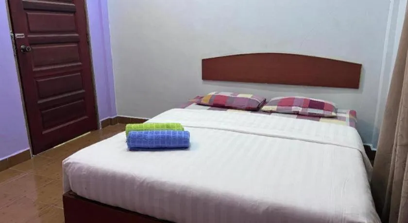 Bed in OYO 90967 Homestay Chalet Warisan Siti