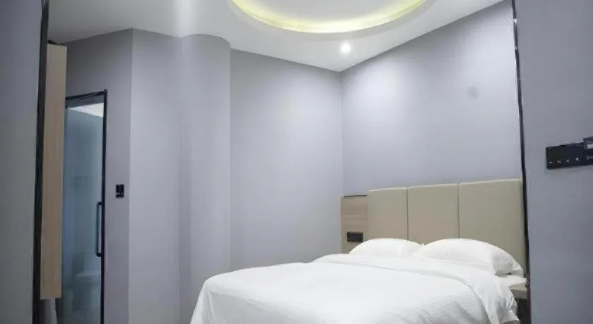 Bed in GreenTree Inn Anqing Tongcheng South Shengtang Road Shengtang International Business Hotel