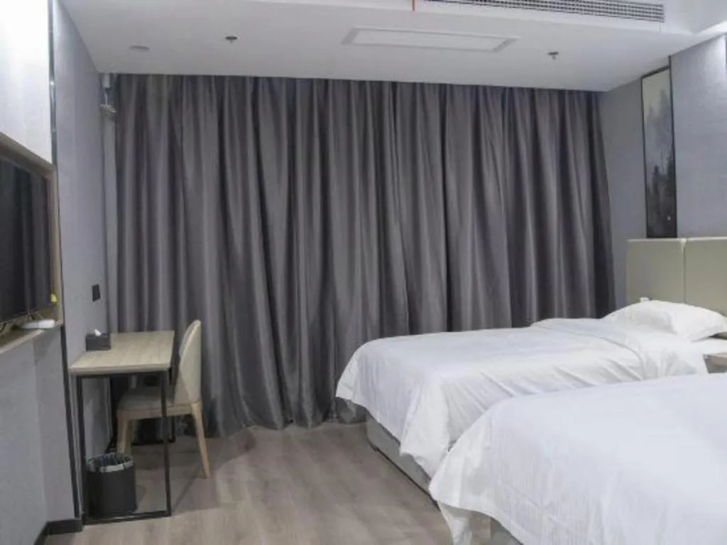 Bed in GreenTree Inn Anqing Tongcheng South Shengtang Road Shengtang International Business Hotel