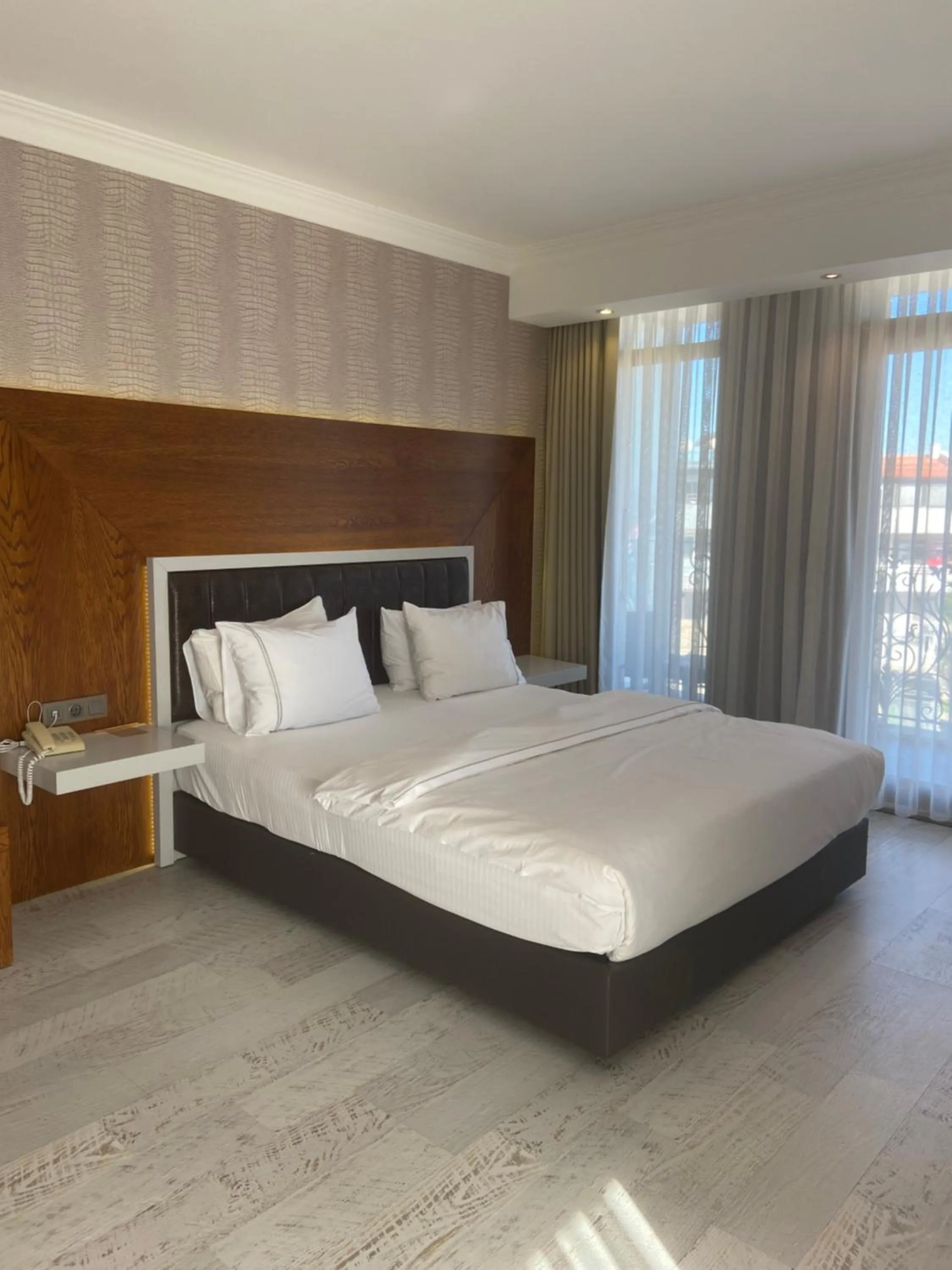 Bed in Maison Vourla Hotel