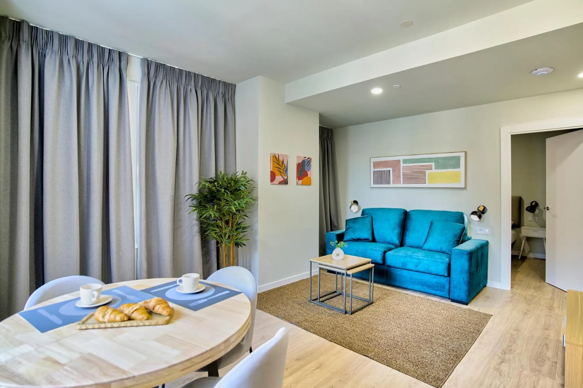 Living room in Apartamentos Olivia by gaiarooms