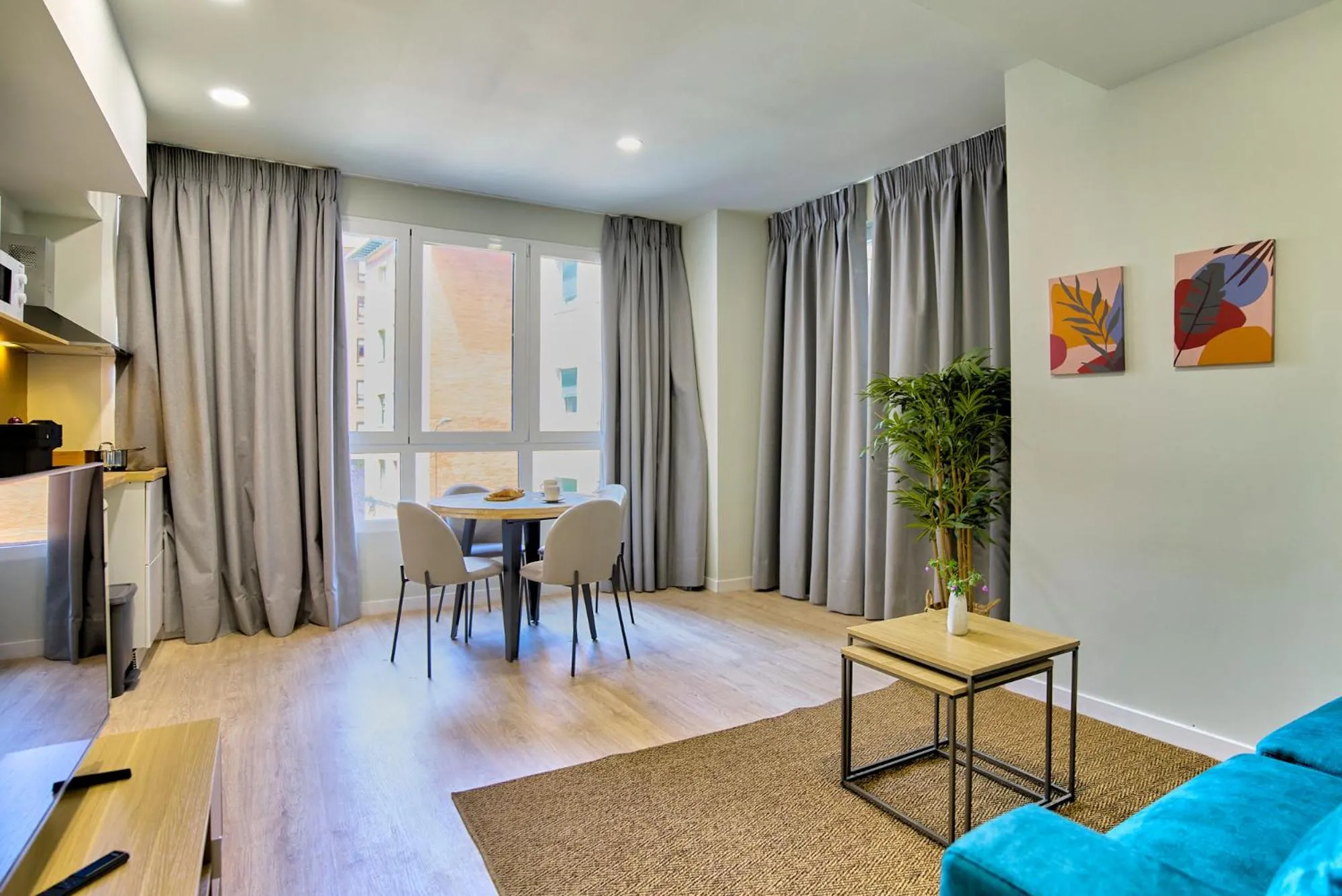 Living room in Apartamentos Olivia by gaiarooms