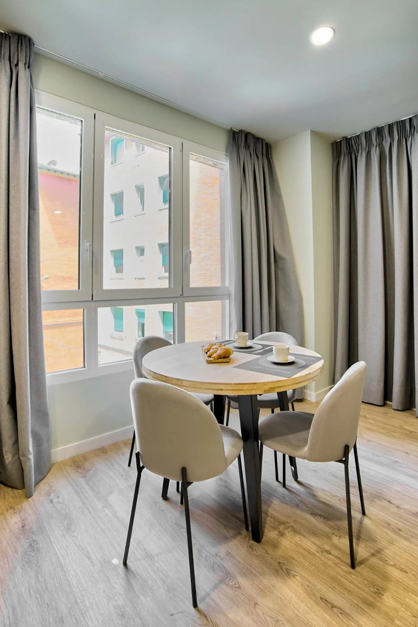 Dining area in Apartamentos Olivia by gaiarooms