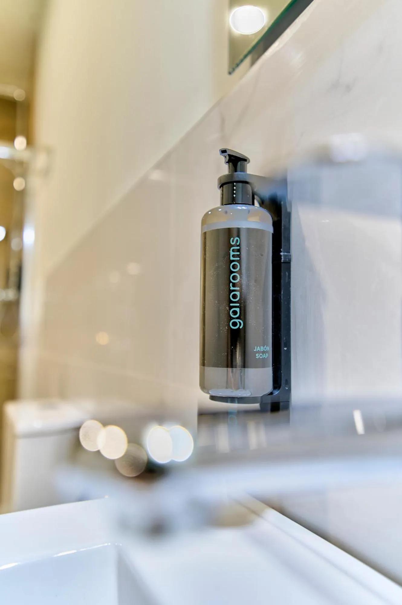 Bathroom in Apartamentos Olivia by gaiarooms