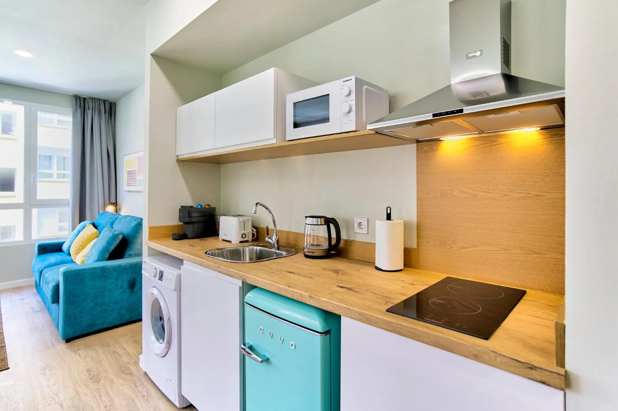 Living room in Apartamentos Olivia by gaiarooms