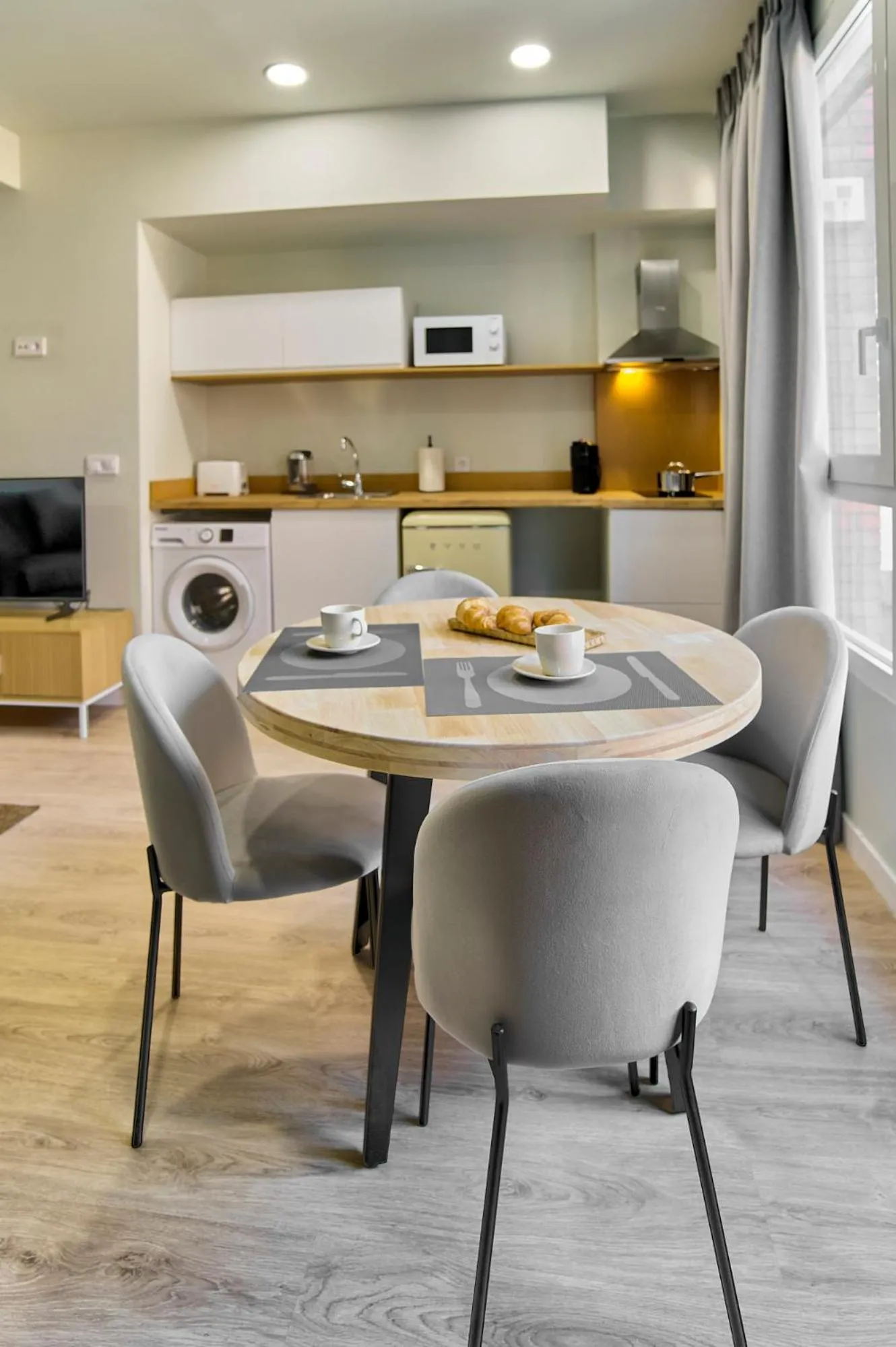 Kitchen or kitchenette in Apartamentos Olivia by gaiarooms