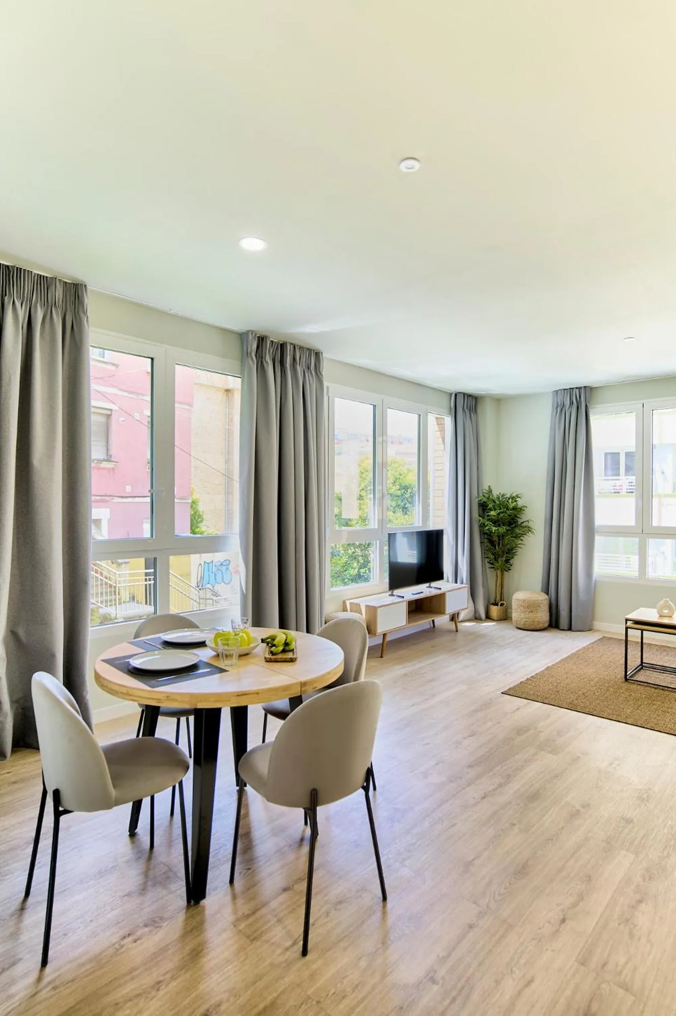 Living room in Apartamentos Olivia by gaiarooms