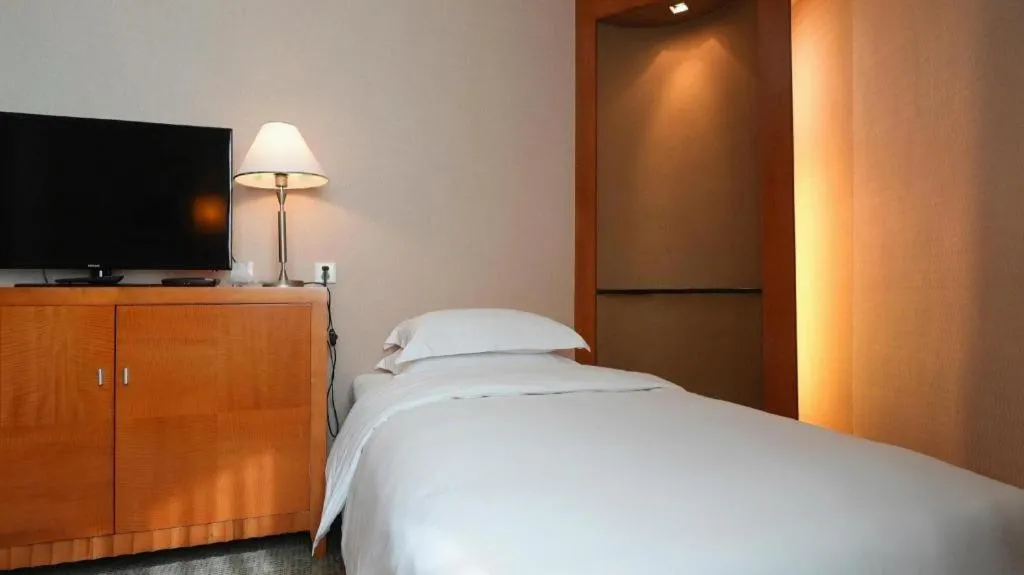 Bed in Haihua Hotel Hangzhou