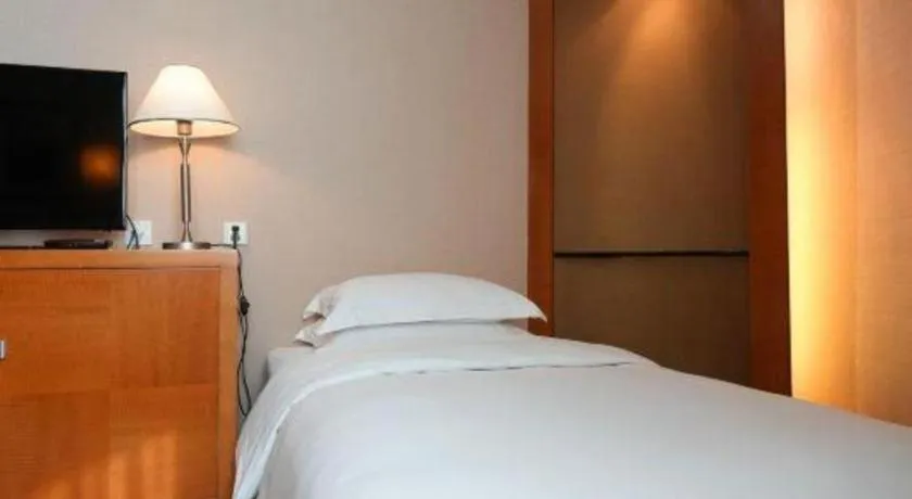 Bed in Haihua Hotel Hangzhou