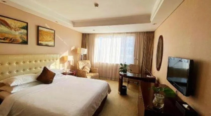 Bed in Maison New Century Hotel Ningbo