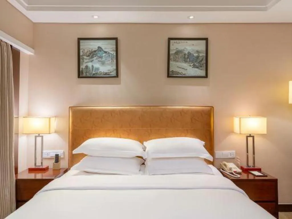 Bed in Maison New Century Hotel Ningbo