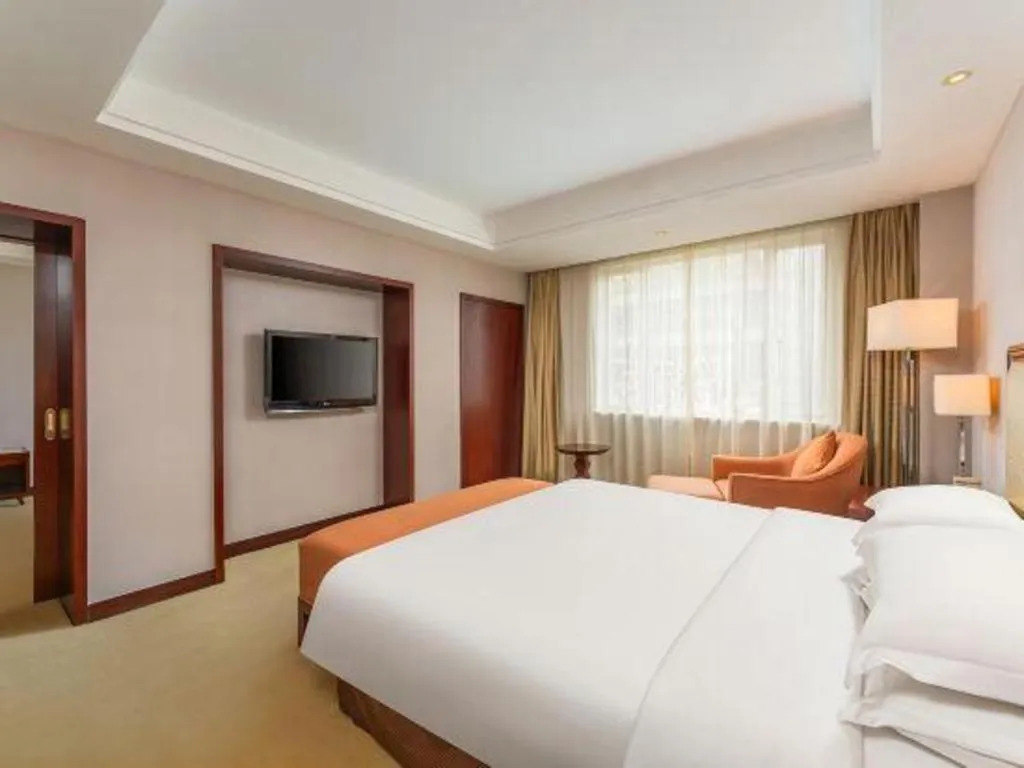 Bed in Maison New Century Hotel Ningbo