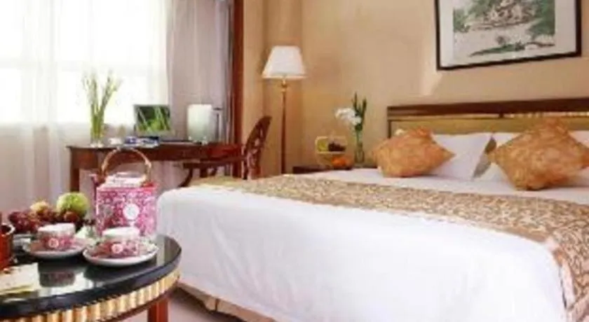 Bed in Maison New Century Hotel Ningbo