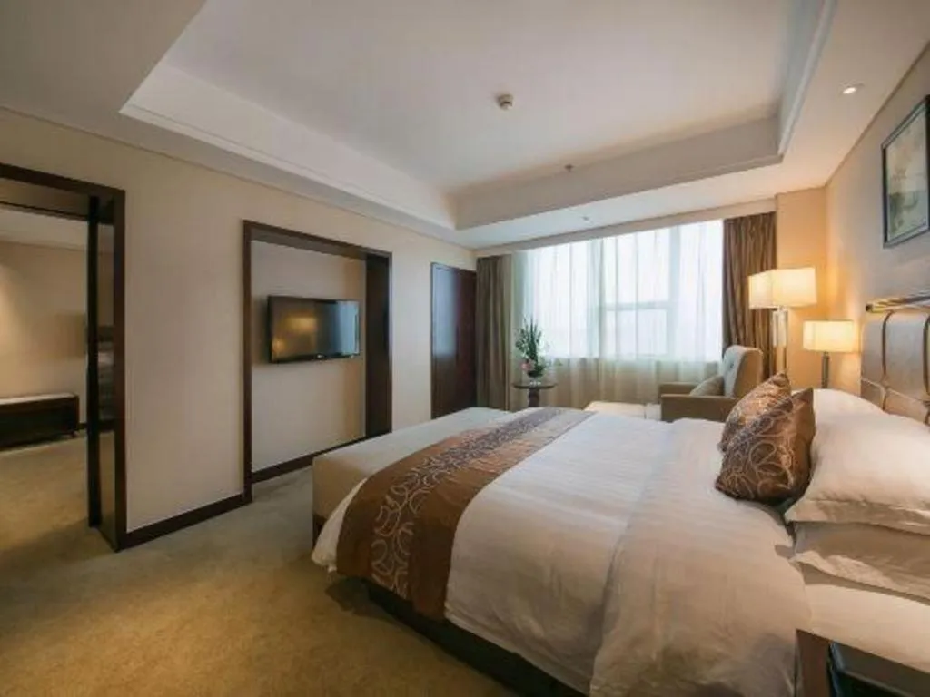 Bed in Maison New Century Hotel Ningbo