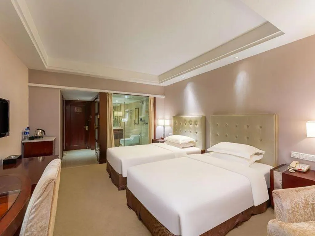 Bed in Maison New Century Hotel Ningbo