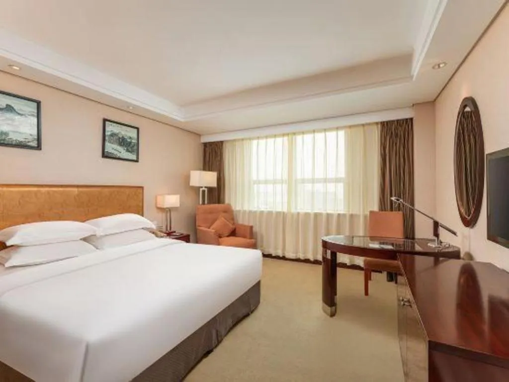 Bed in Maison New Century Hotel Ningbo