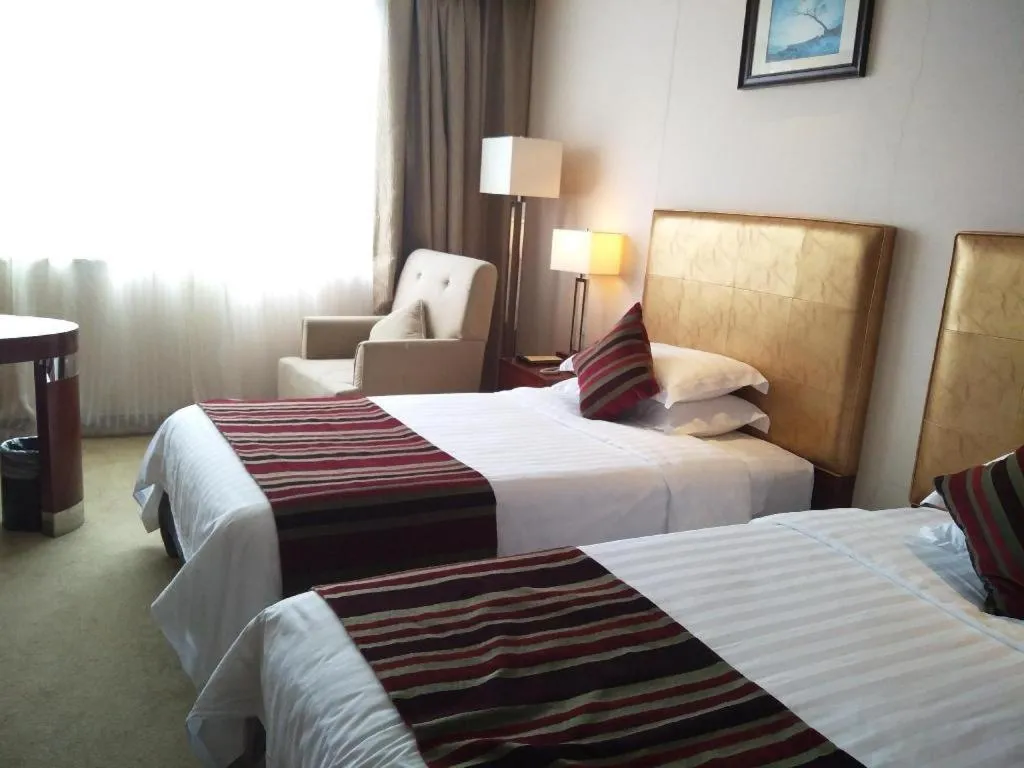 Bed in Maison New Century Hotel Ningbo