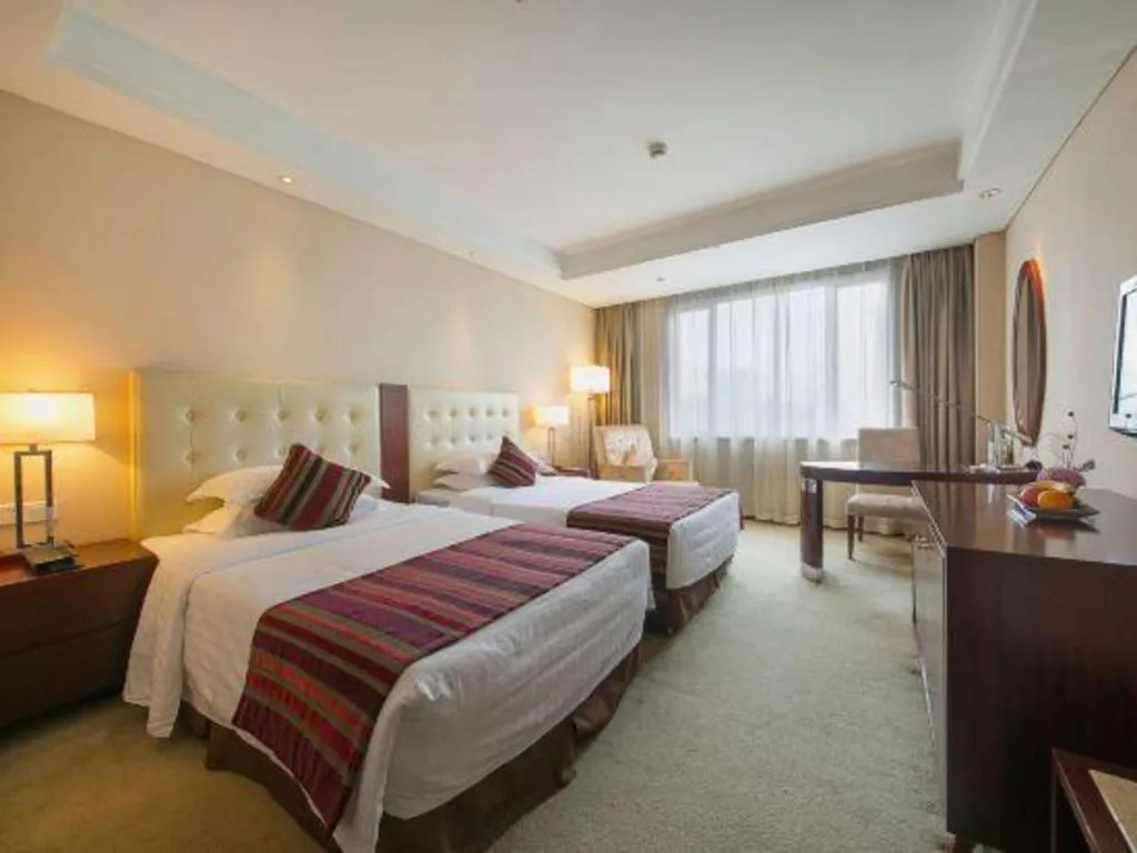 Bed in Maison New Century Hotel Ningbo