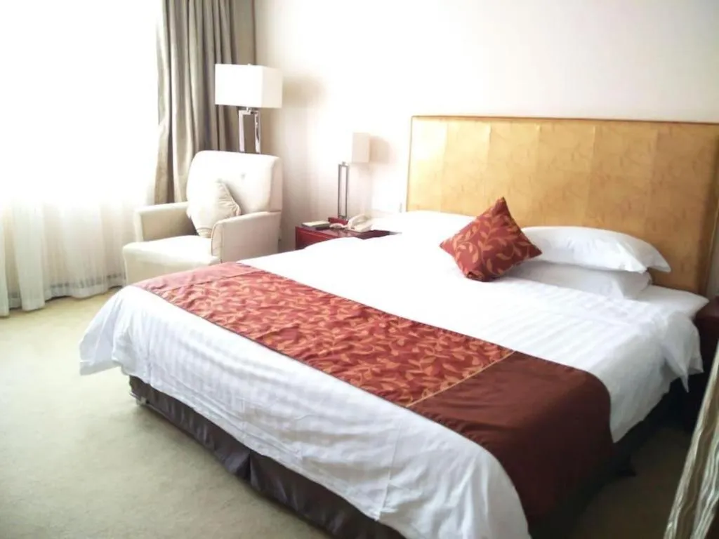 Bed in Maison New Century Hotel Ningbo