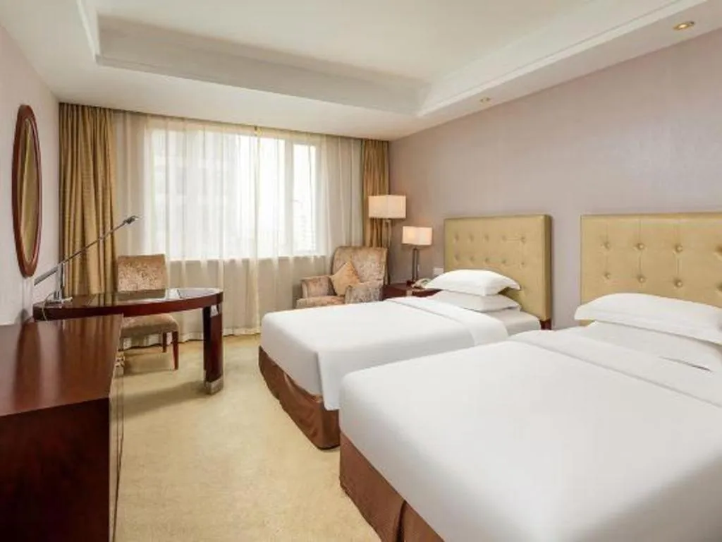 Bed in Maison New Century Hotel Ningbo