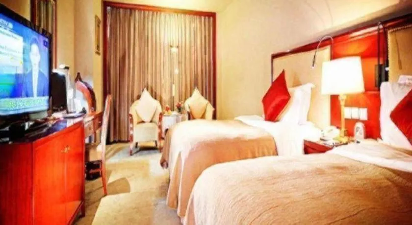 Bed in Xinhai Jinjiang Hotel